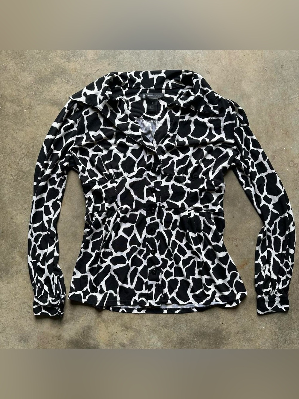 Black and white animal print blouse with button-up front and long sleeves